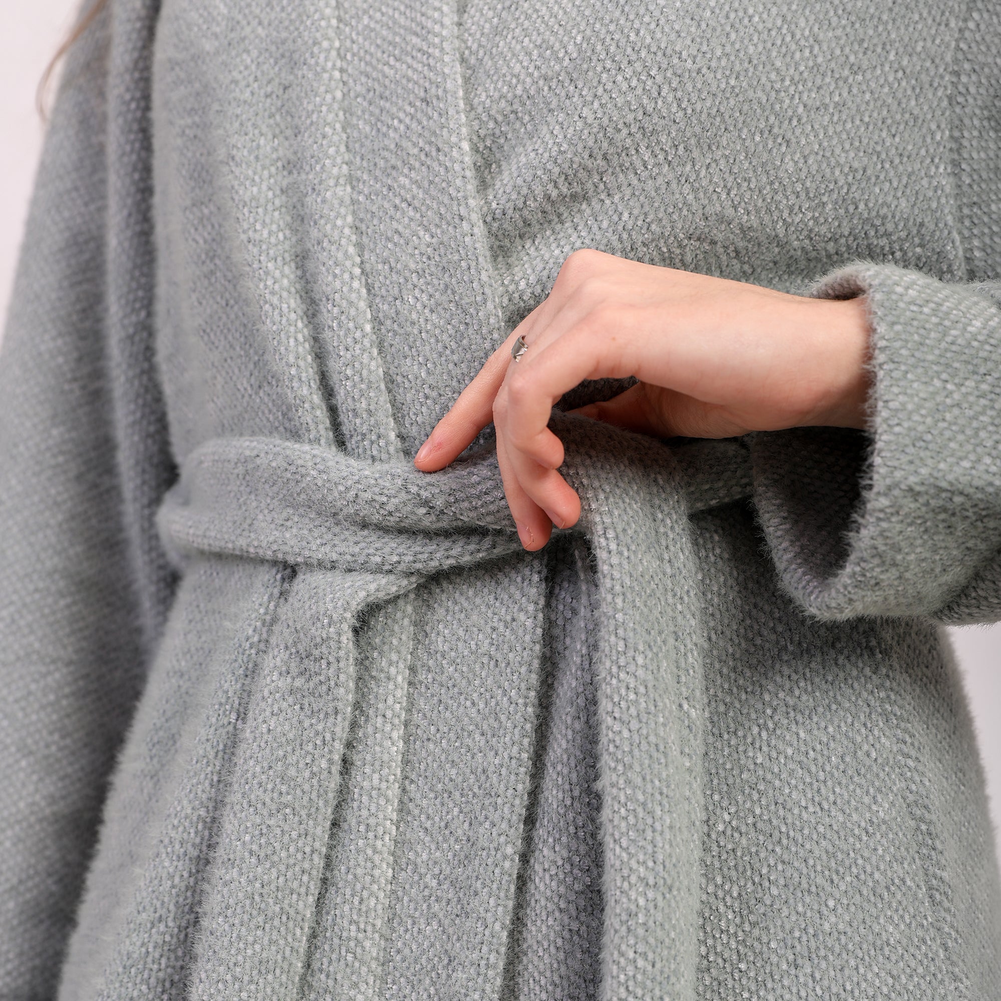 Wrap yourself in effortless warmth with this long wool robe, designed to blend comfort and refined elegance.