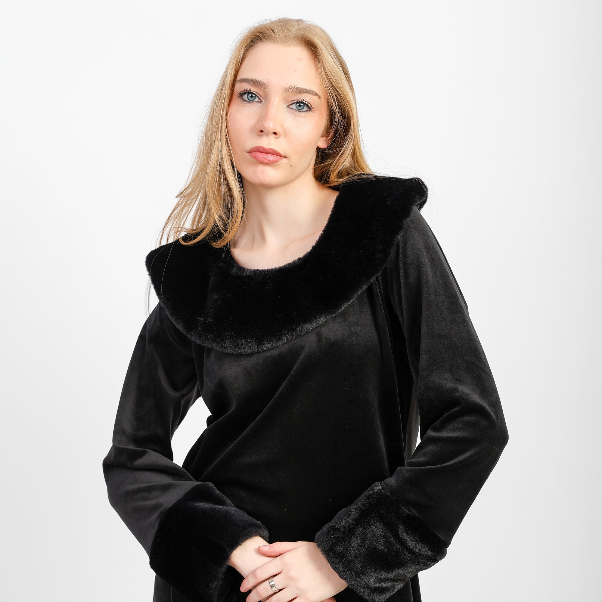 A winter velvet abaya in deep black, designed with a refined
