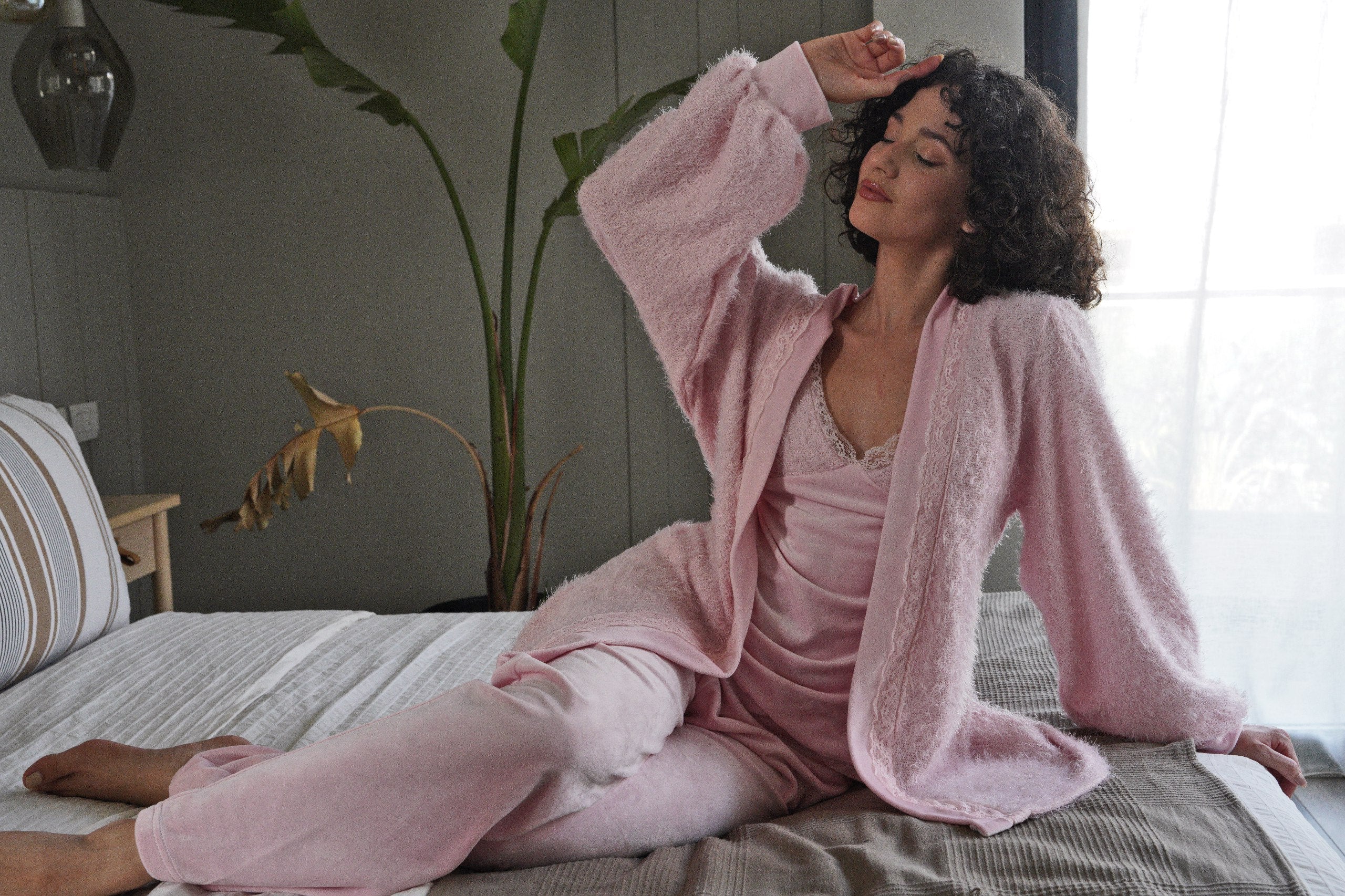 A soft pink three-piece loungewear set designed for ultimate elegance and comfort.