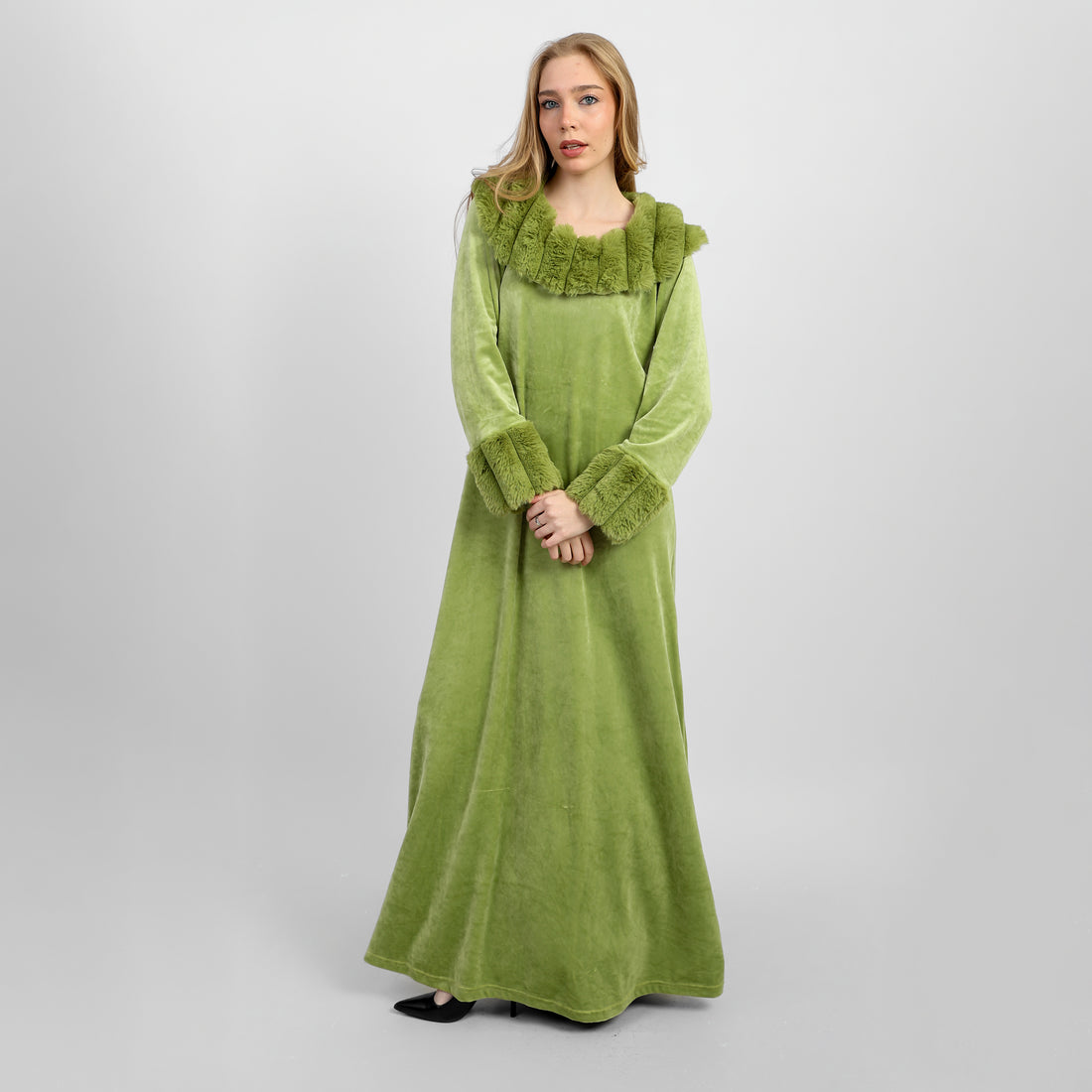 A full-length winter gown crafted from soft, luxurious velvet in a refined green shade.