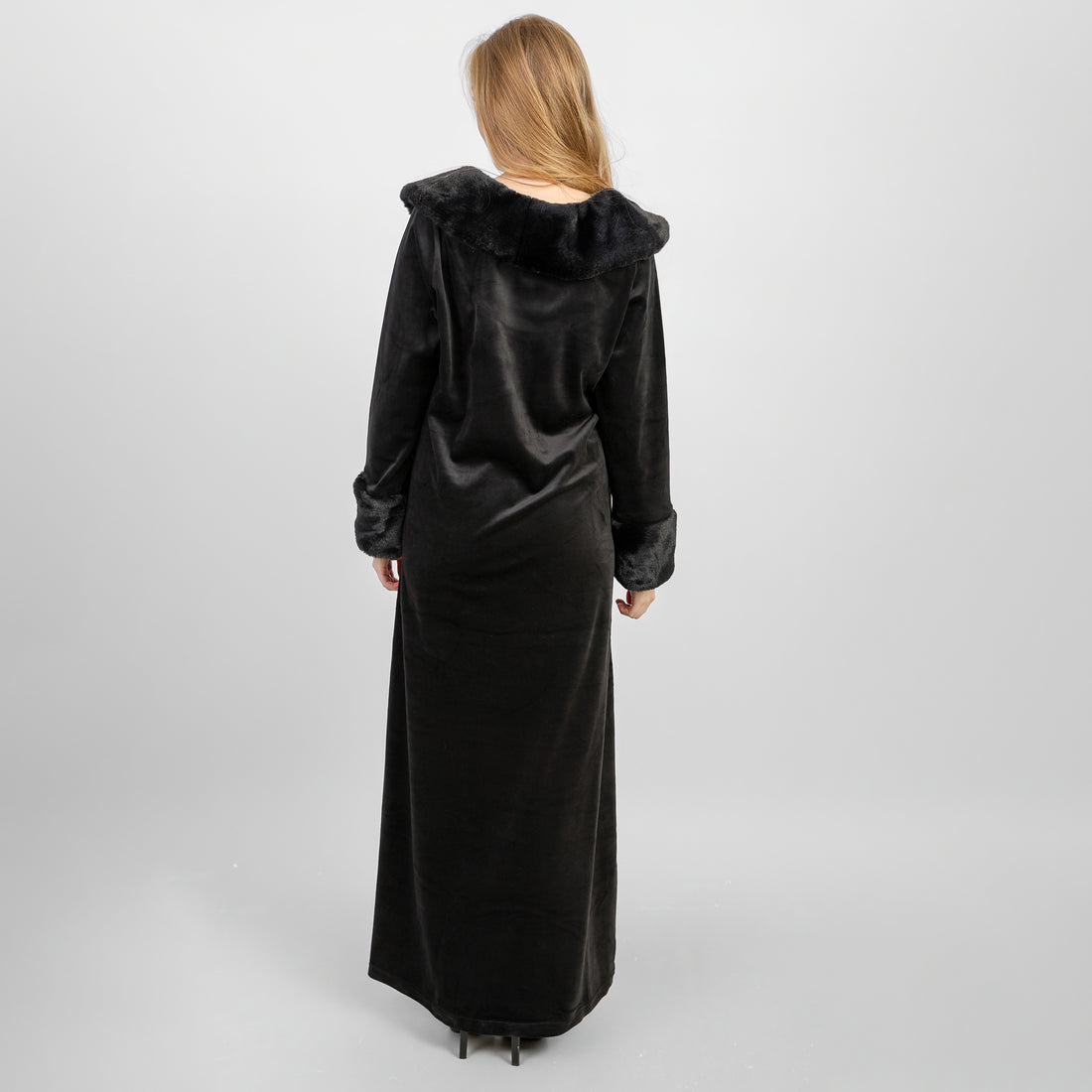 A winter velvet abaya in deep black, designed with a refined