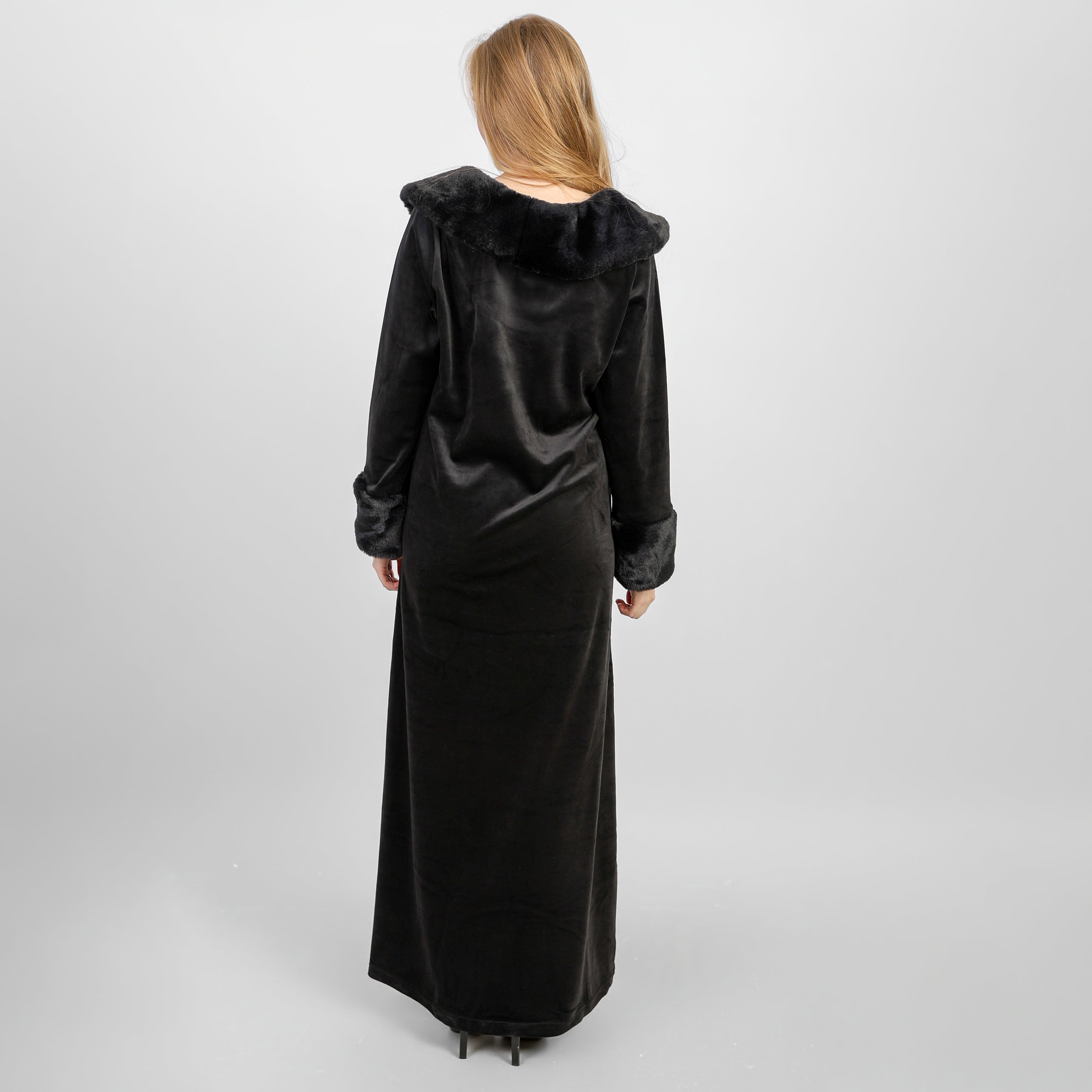 A winter velvet abaya in deep black, designed with a refined