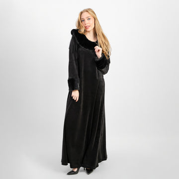 A winter velvet abaya in deep black, designed with a refined